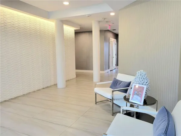 a view of room with furniture and wooden floor