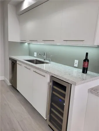 a kitchen with a sink and cabinets