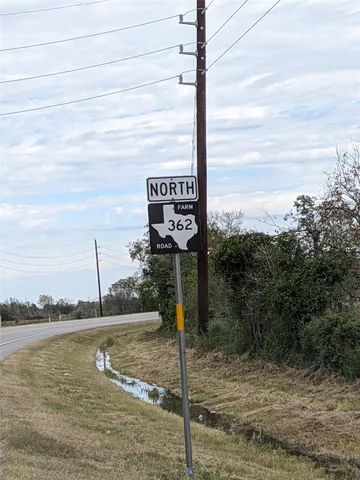 a sign board with a lake view