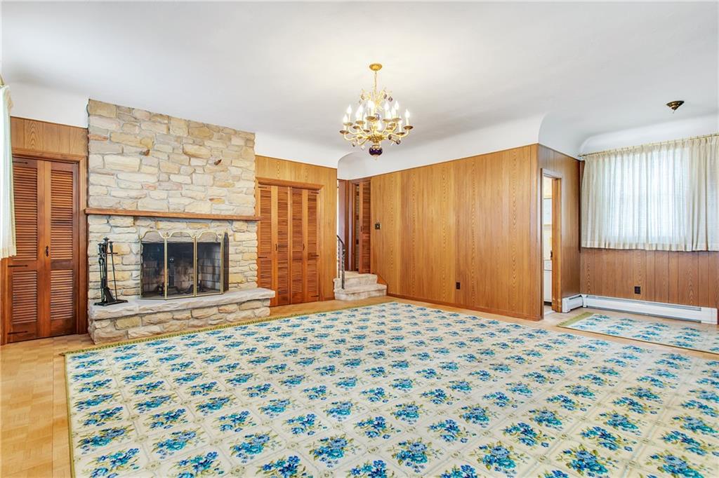 1710 Roosevelt Road Pittsburgh, PA 15237 - Photo 7 of 20 Spacious family room with log burning fireplace with stone accents and featuring a convenient full bath. Could be large Master Suite !