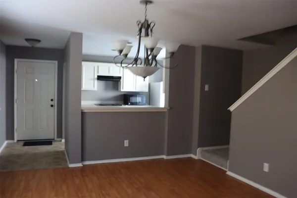 a view of a kitchen from the hallway