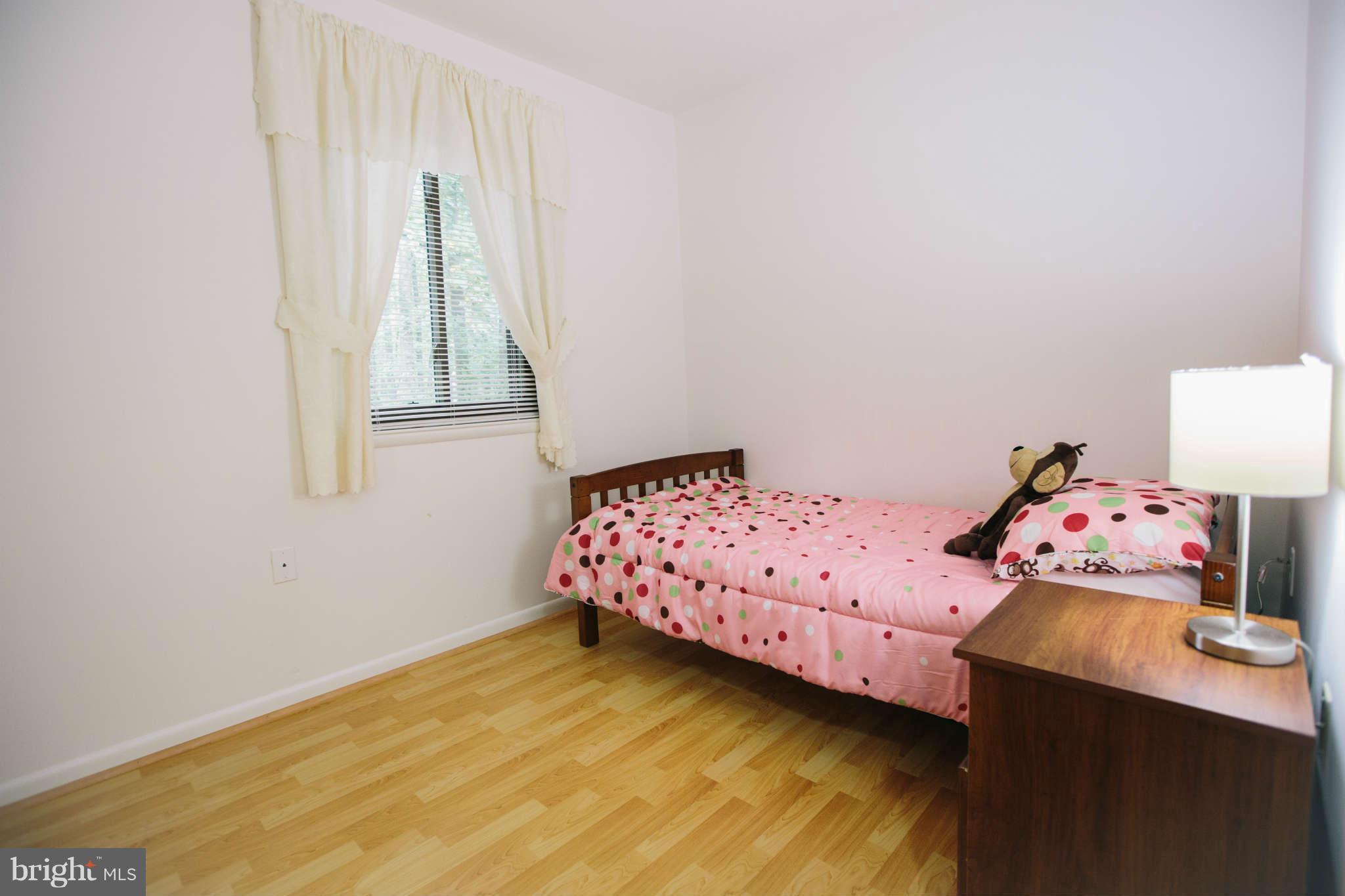 2226 Lofty Heights Place Reston, VA 20191 - Photo 12 of 25 a bedroom with a bed and window