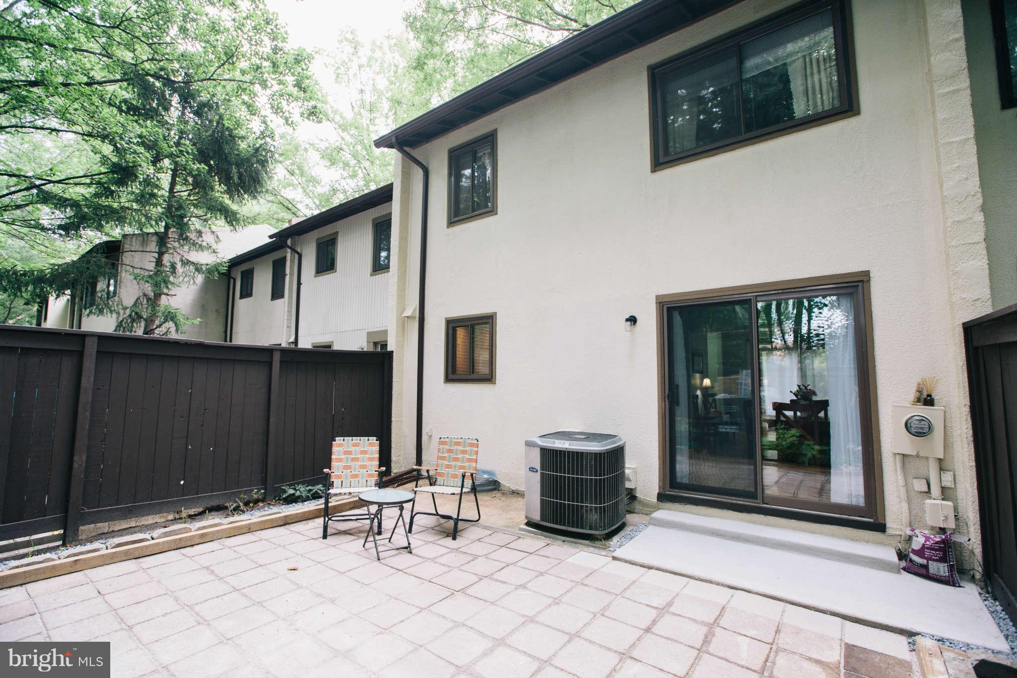 2226 Lofty Heights Place Reston, VA 20191 - Photo 19 of 25 a view of a patio with table and chairs and potted plants