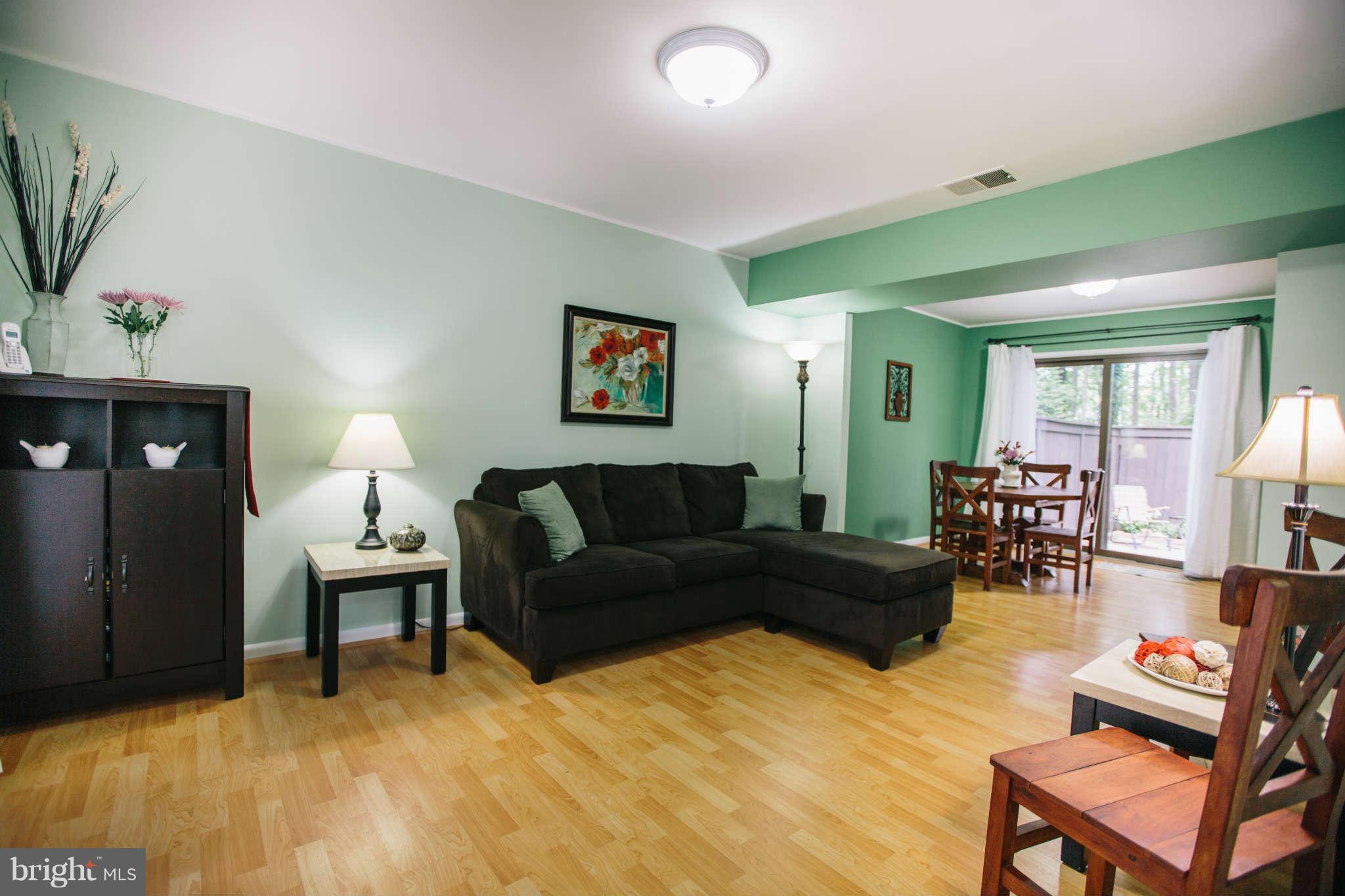 2226 Lofty Heights Place Reston, VA 20191 - Photo 3 of 25 a living room with furniture and a lamp