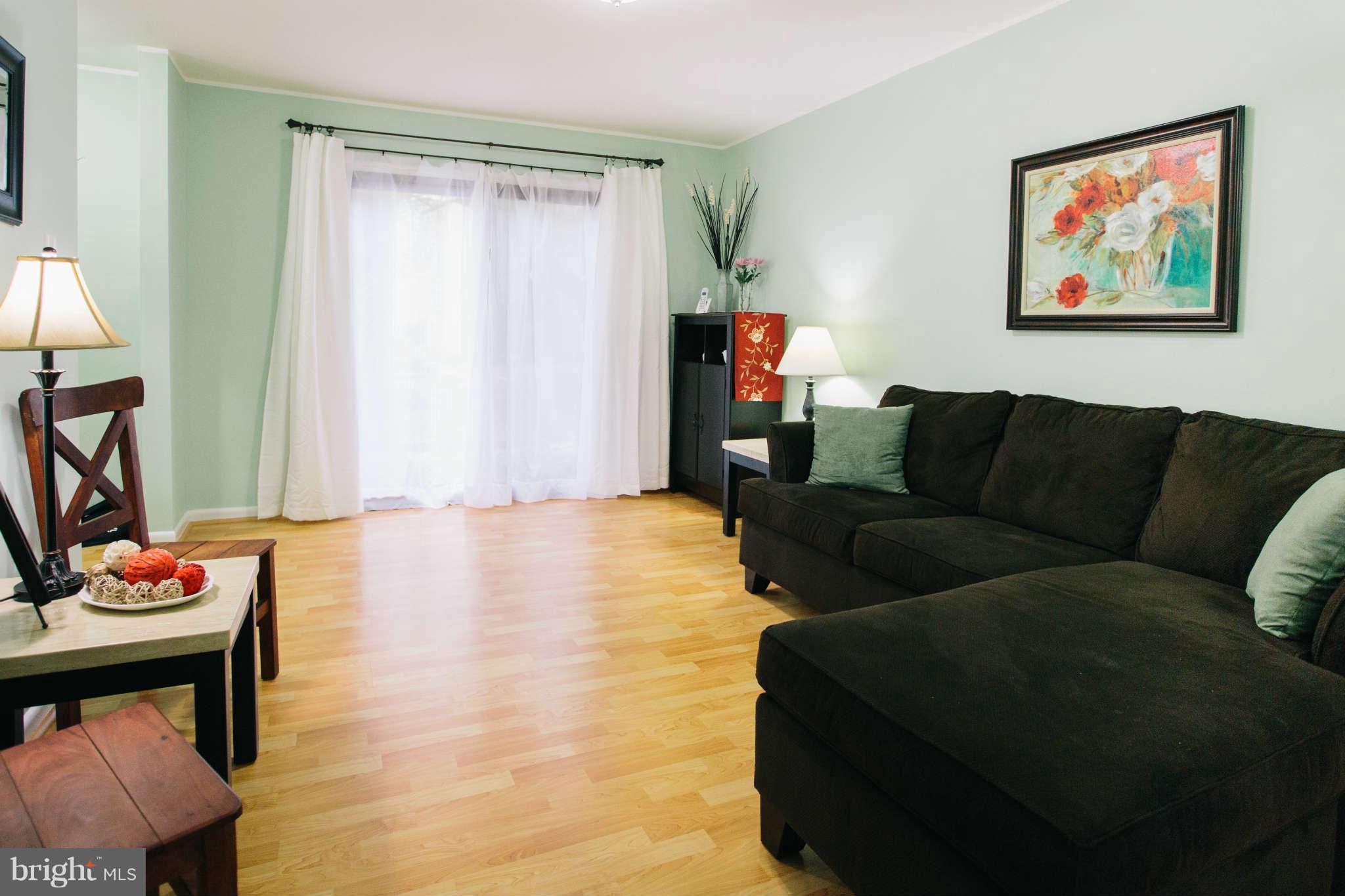 2226 Lofty Heights Place Reston, VA 20191 - Photo 4 of 25 a living room with furniture and a window