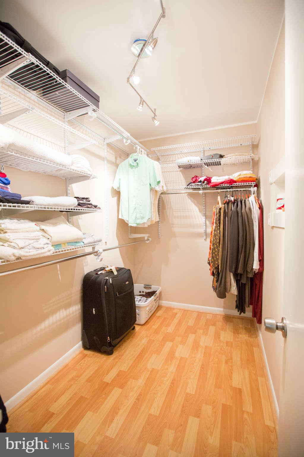 2226 Lofty Heights Place Reston, VA 20191 - Photo 10 of 25 a bedroom with a bed and a walk in closet