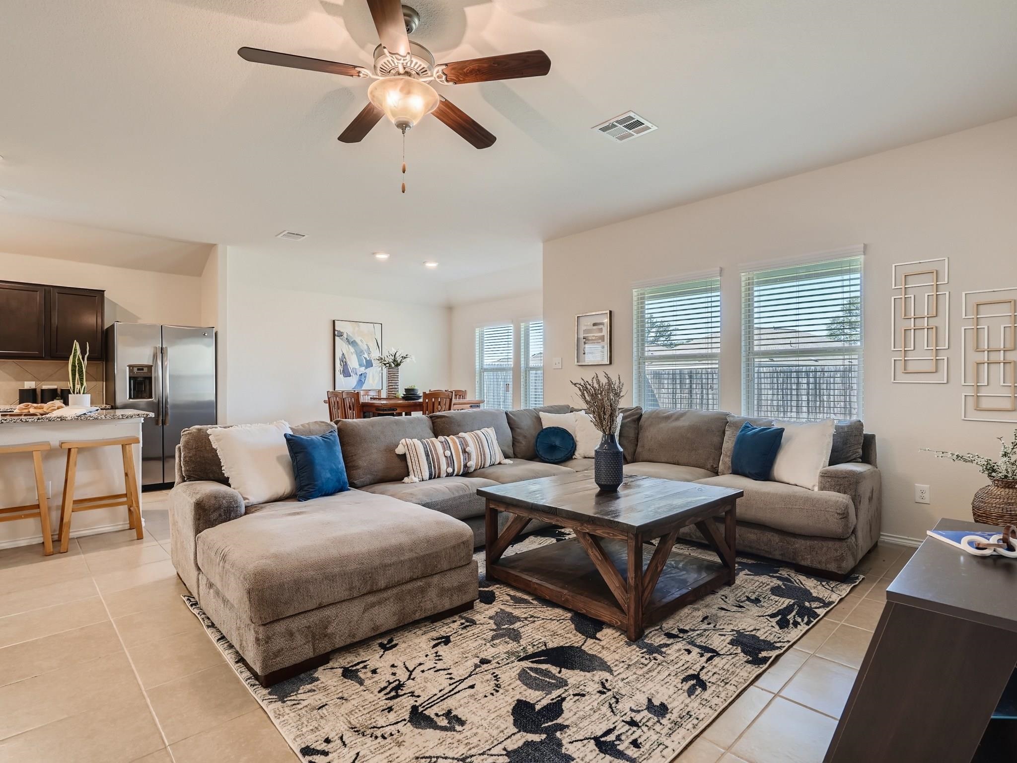 644 Heritage Grove Road Leander, TX 78641 - Photo 1 of 1 a living room with furniture a rug and a window