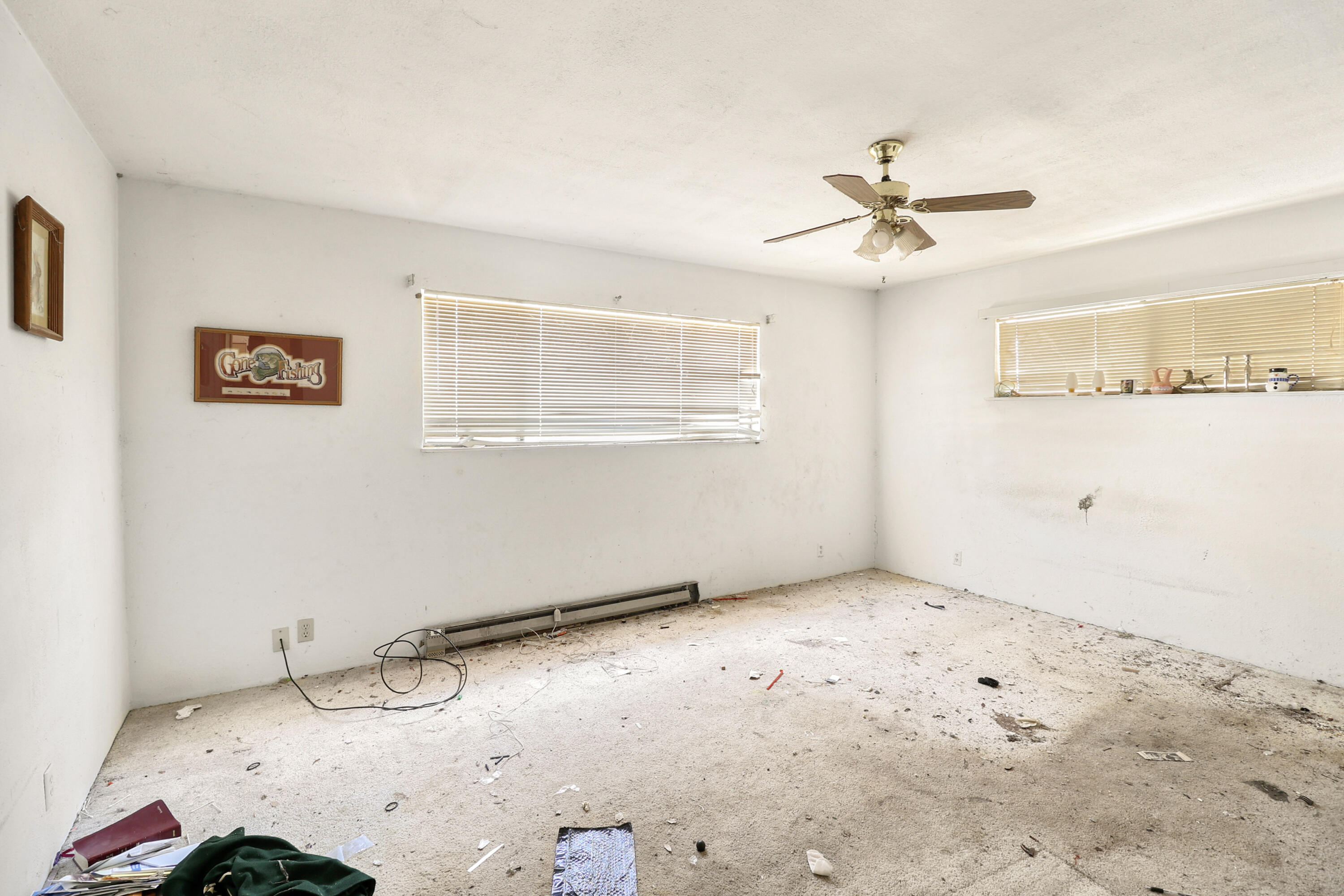 21217 Falling Oaks Road Redding, CA 96003 - Photo 17 of 24 a view of a big room with wooden floor and windows