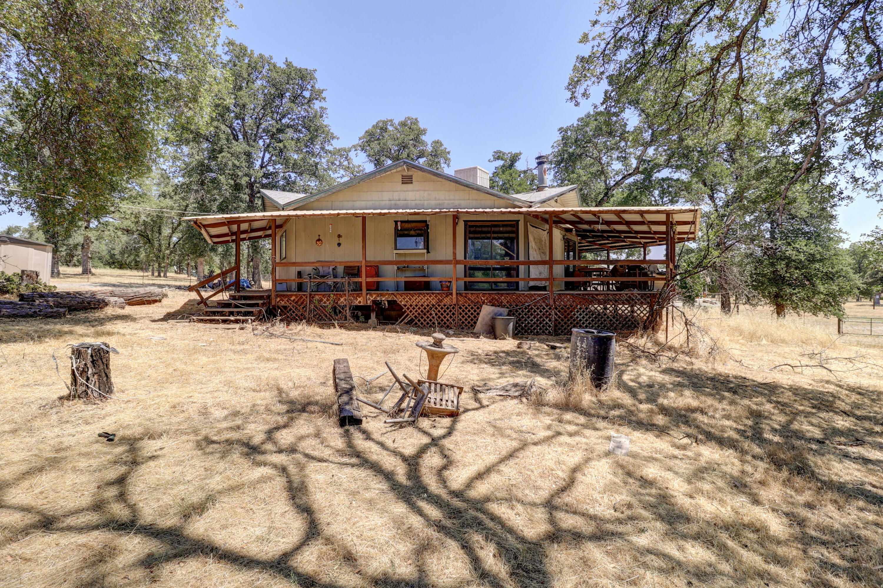 21217 Falling Oaks Road Redding, CA 96003 - Photo 2 of 24 a view of a house with snow on the road