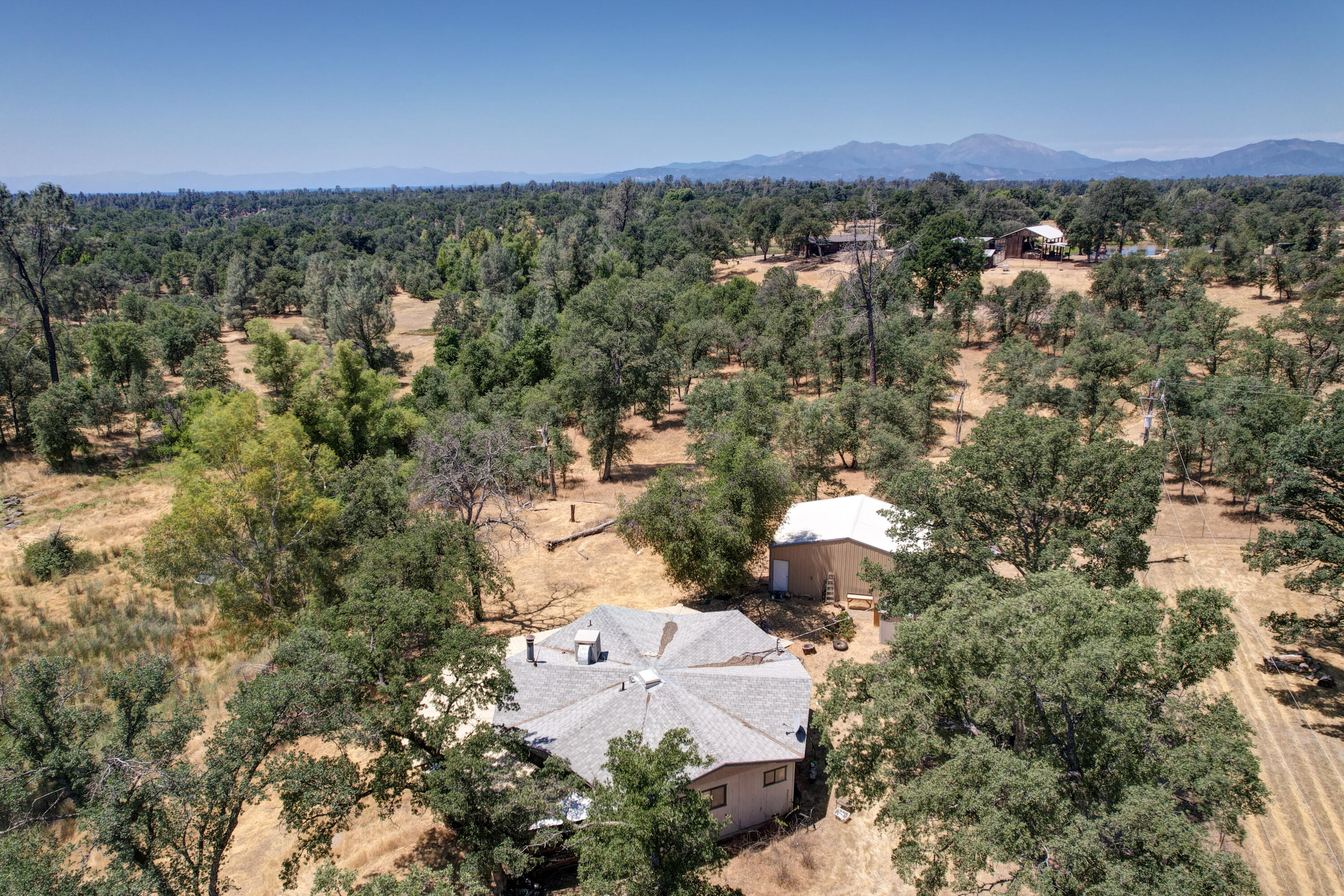 21217 Falling Oaks Road Redding, CA 96003 - Photo 23 of 24 an aerial view of residential houses with outdoor space and trees