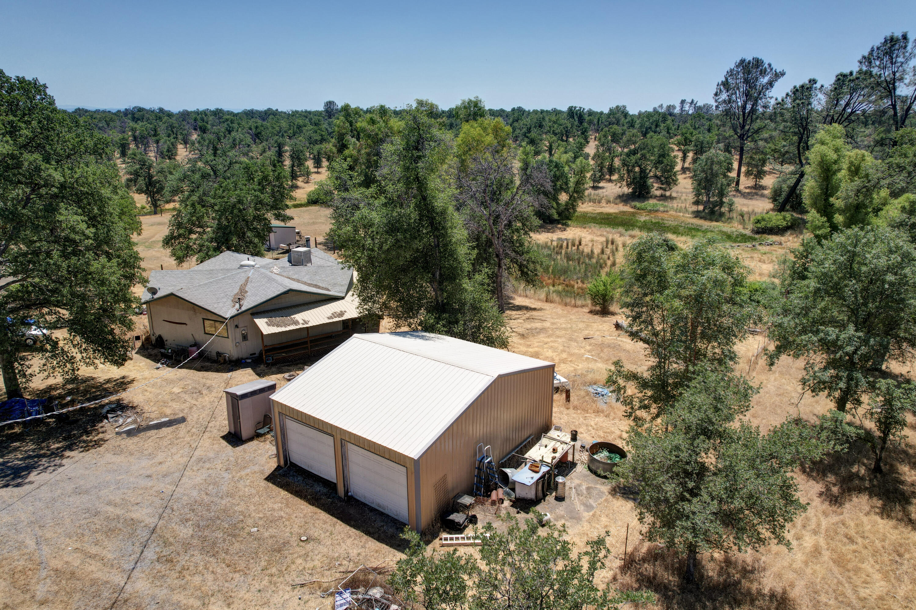 21217 Falling Oaks Road Redding, CA 96003 - Photo 4 of 24 a view of a house with pool and a yard
