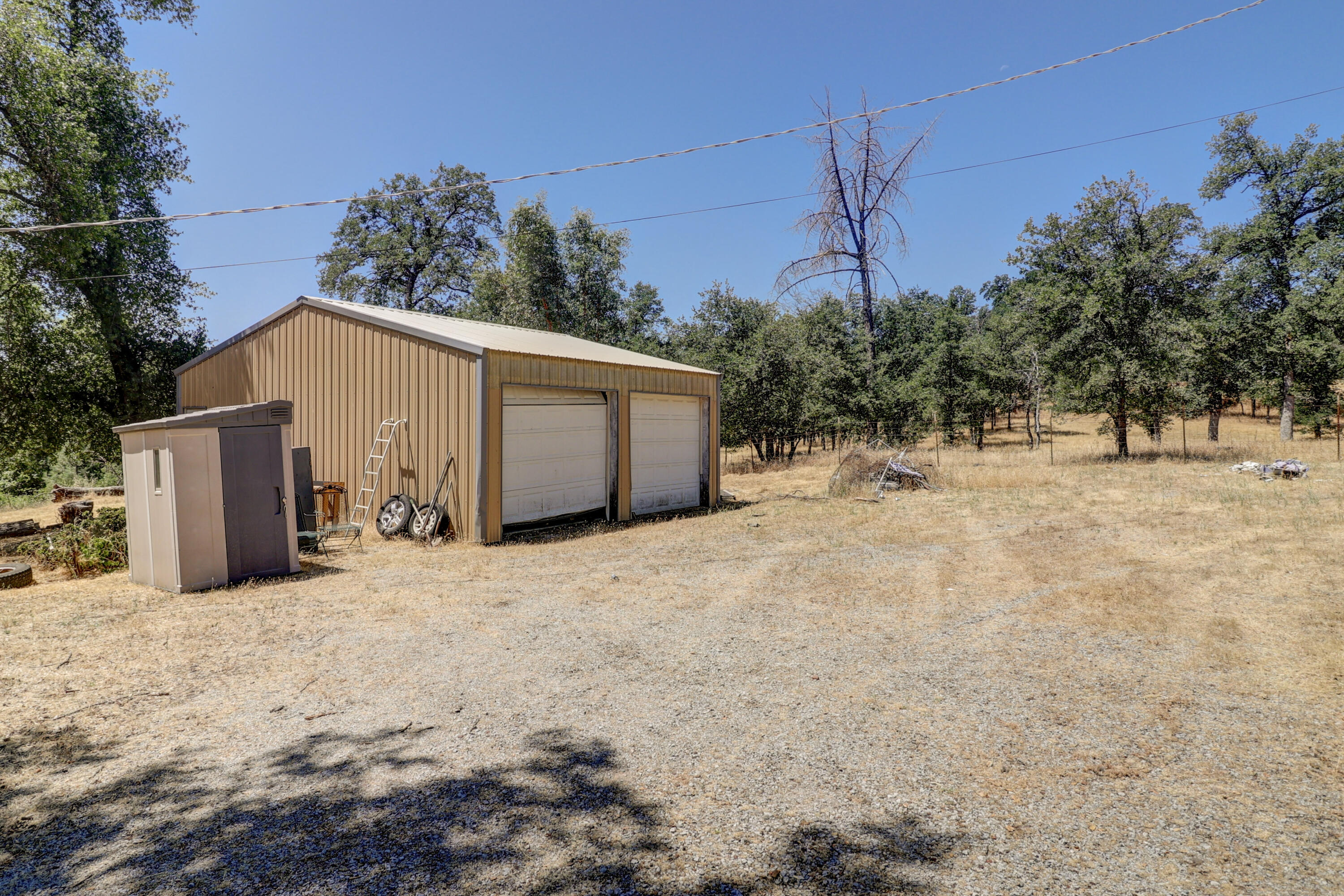 21217 Falling Oaks Road Redding, CA 96003 - Photo 5 of 24 a view of a house with a snow in the yard