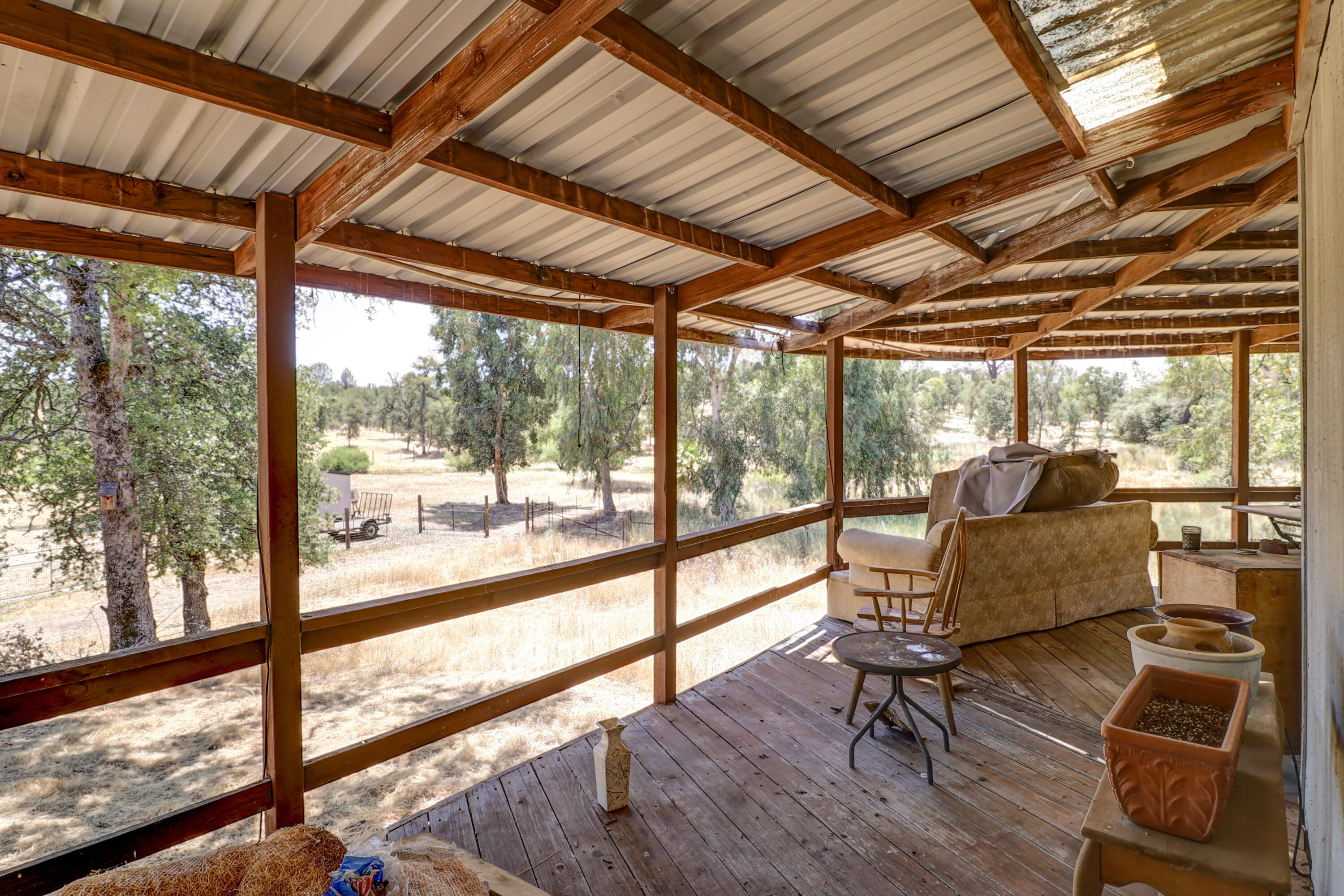 21217 Falling Oaks Road Redding, CA 96003 - Photo 6 of 24 a living room with furniture and wooden floor
