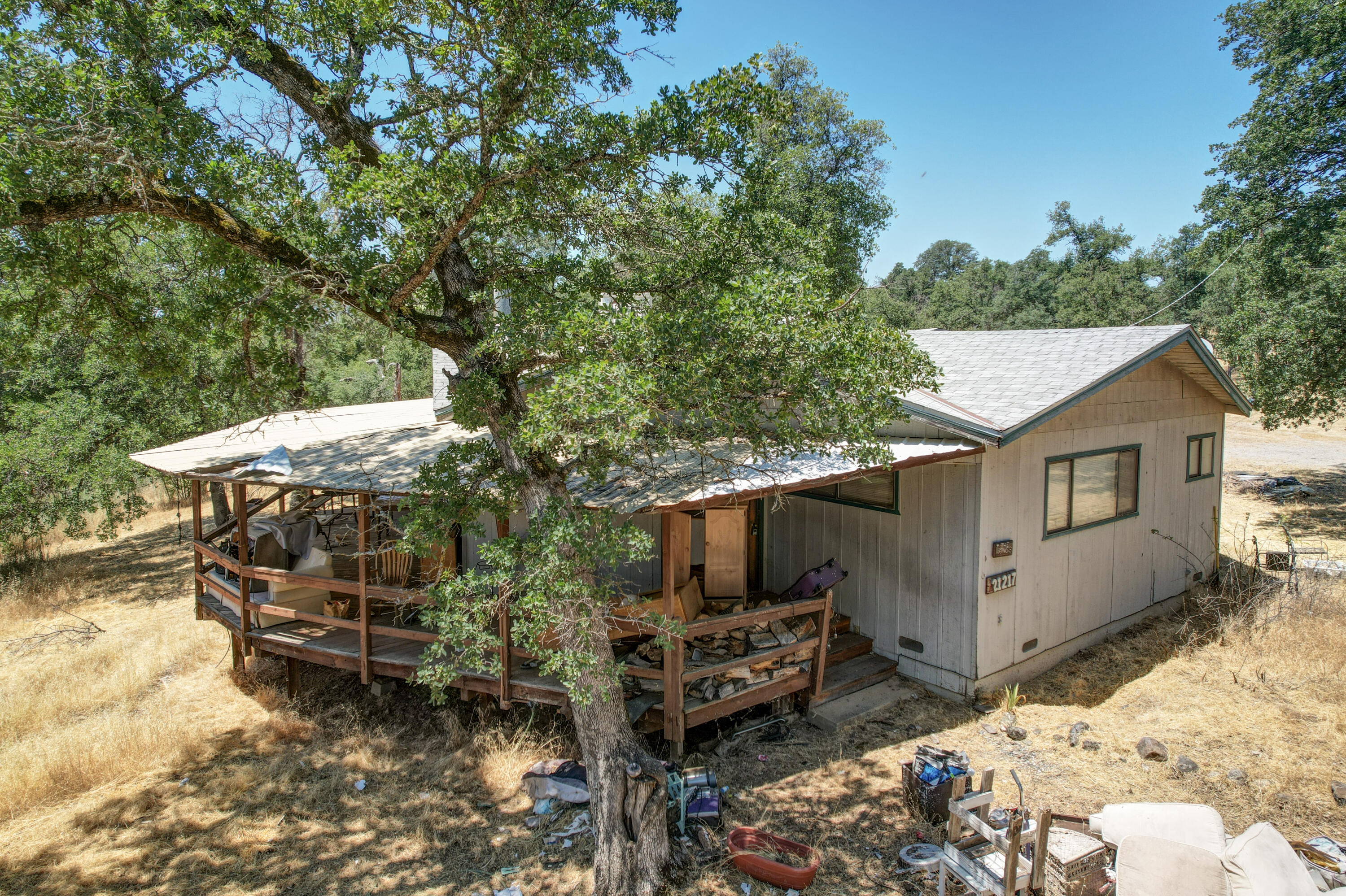 21217 Falling Oaks Road Redding, CA 96003 - Photo 7 of 24 a view of a backyard with couches and a fire pit