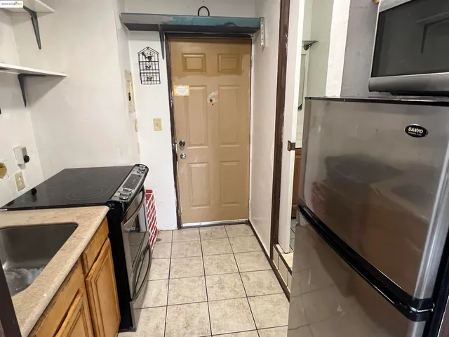 a white toilet sitting next to a small sink