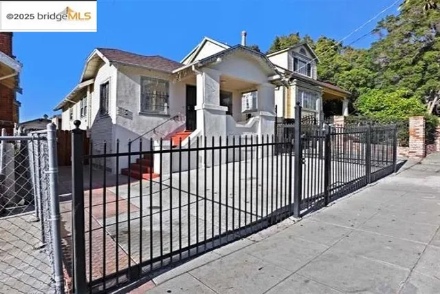a view of a white house with large windows
