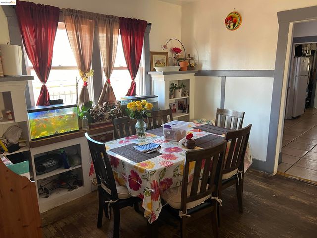 a view of a dining room with furniture and window