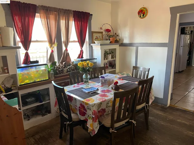 a view of a dining room with furniture and window