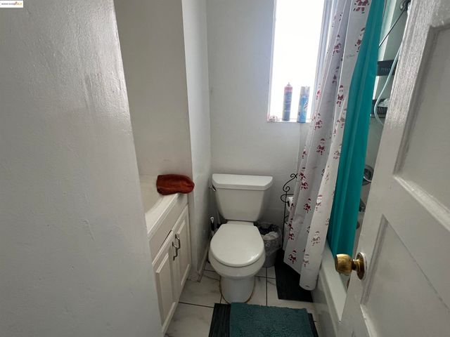 a white toilet sitting next to a small sink