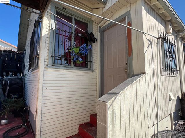 a living room with furniture and ceiling fan