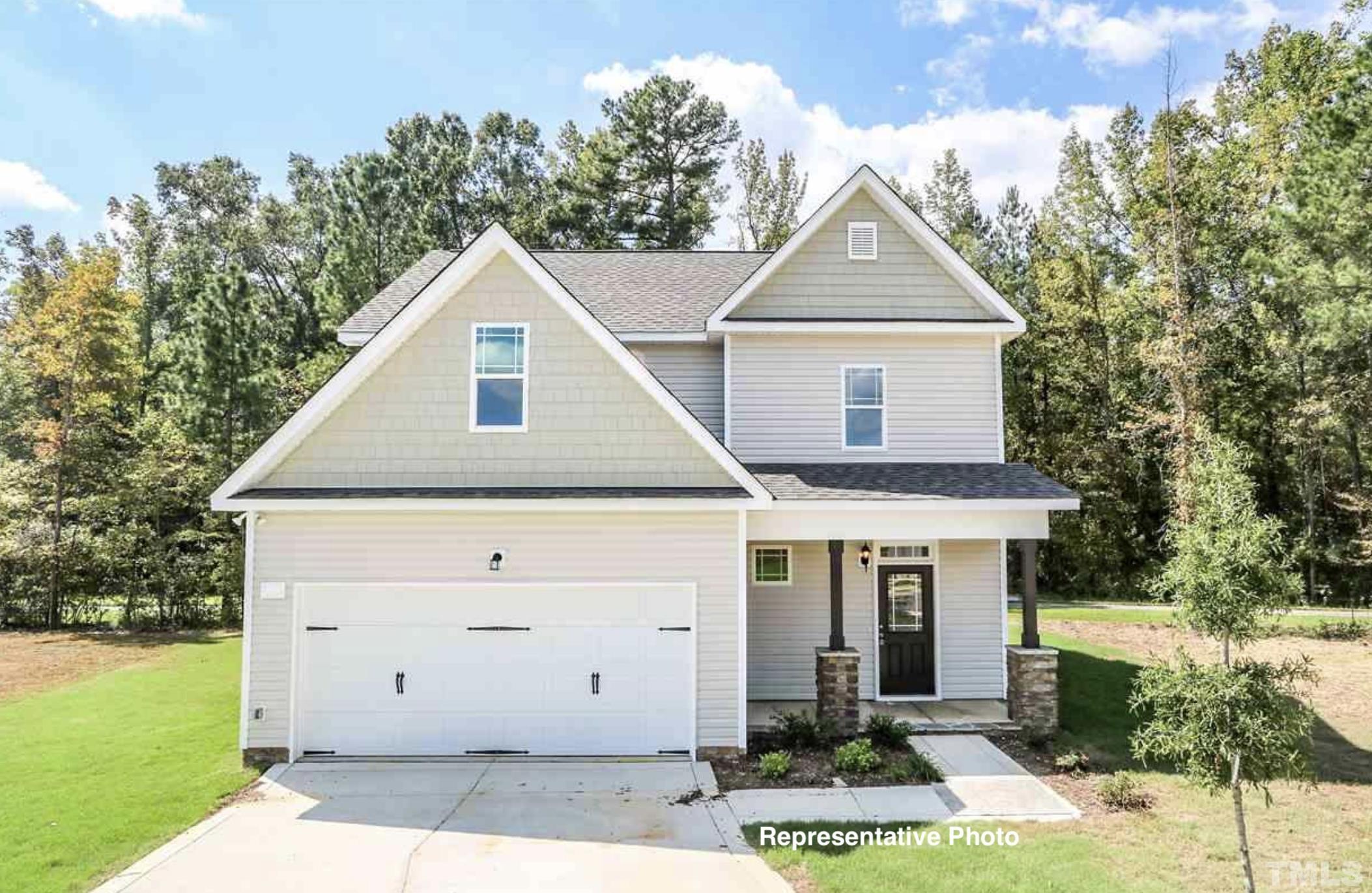 187 East Clydes Point Way Wendell, NC 27591 - Photo 1 of 9 a front view of a house with garden