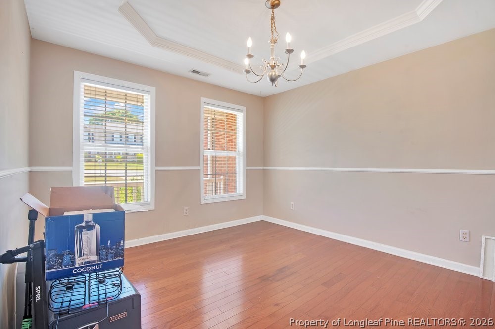 10 Pender Road Spring Lake, NC 28390 - Photo 4 of 35 wooden floor in an empty room with a window
