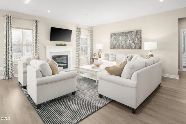 a living room with furniture and a table