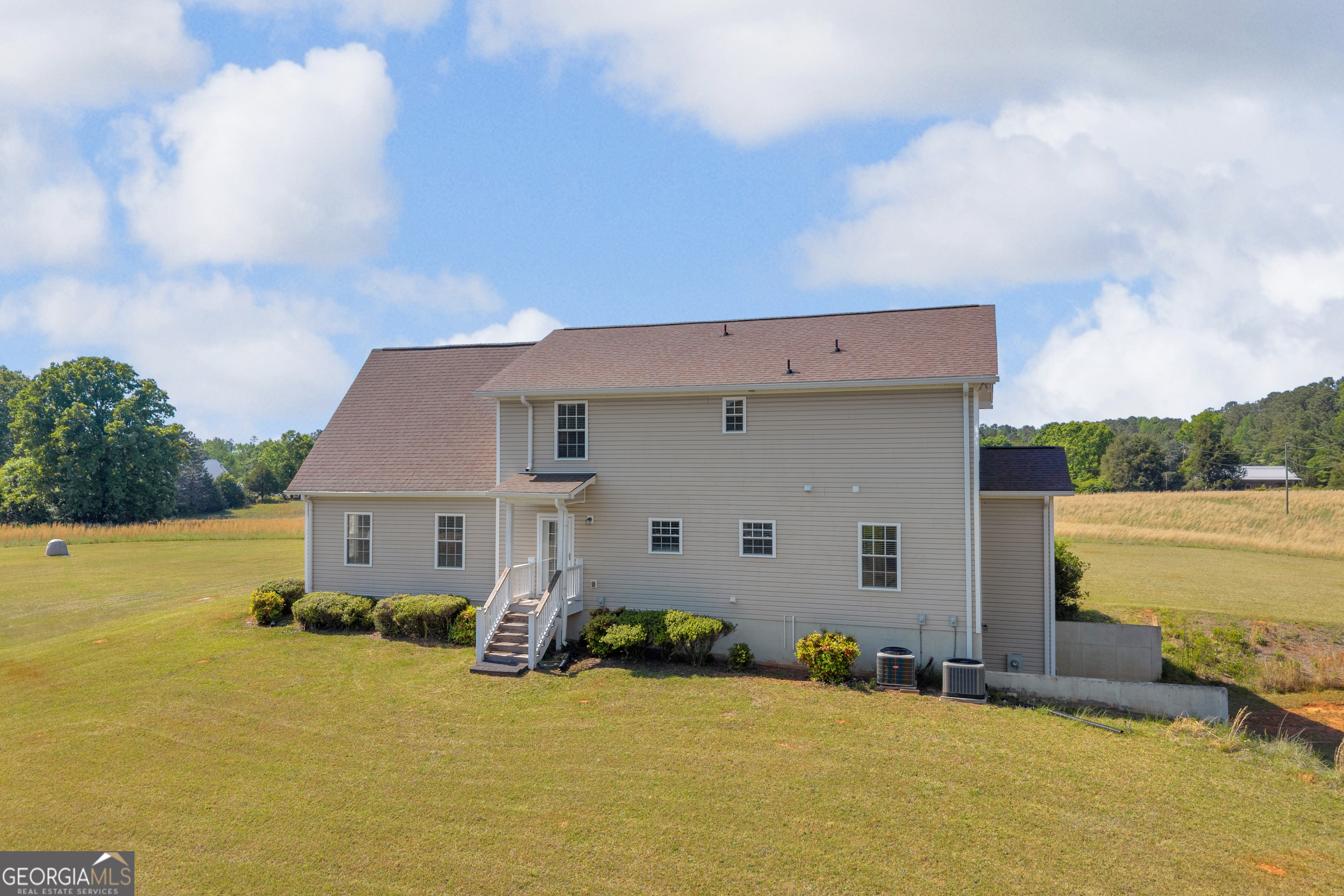 3248 Metasville Road Washington, GA 30673 - Photo 14 of 97 a view of a house with pool and a yard