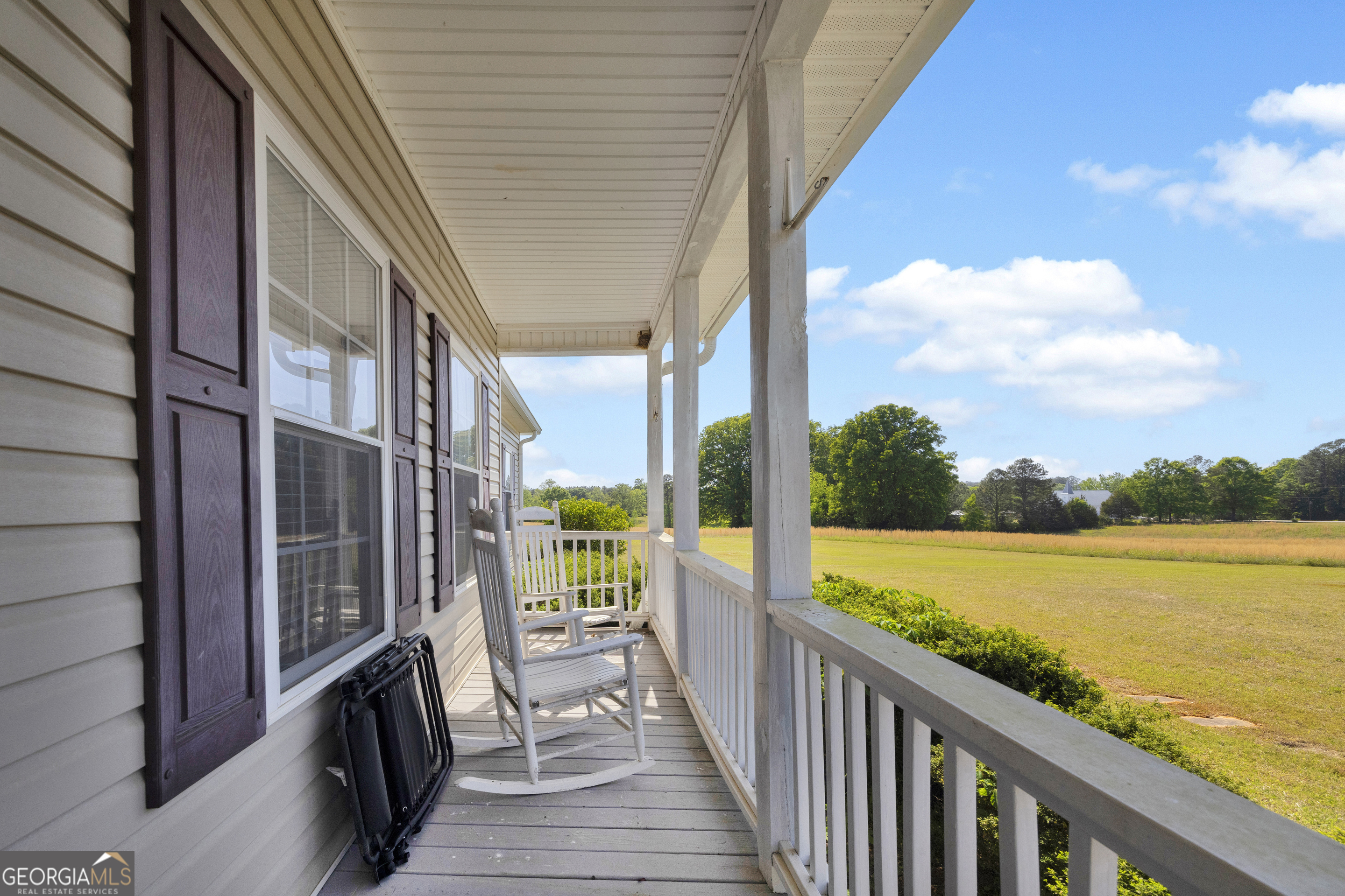 3248 Metasville Road Washington, GA 30673 - Photo 18 of 97 a view of a balcony with lake and mountain view