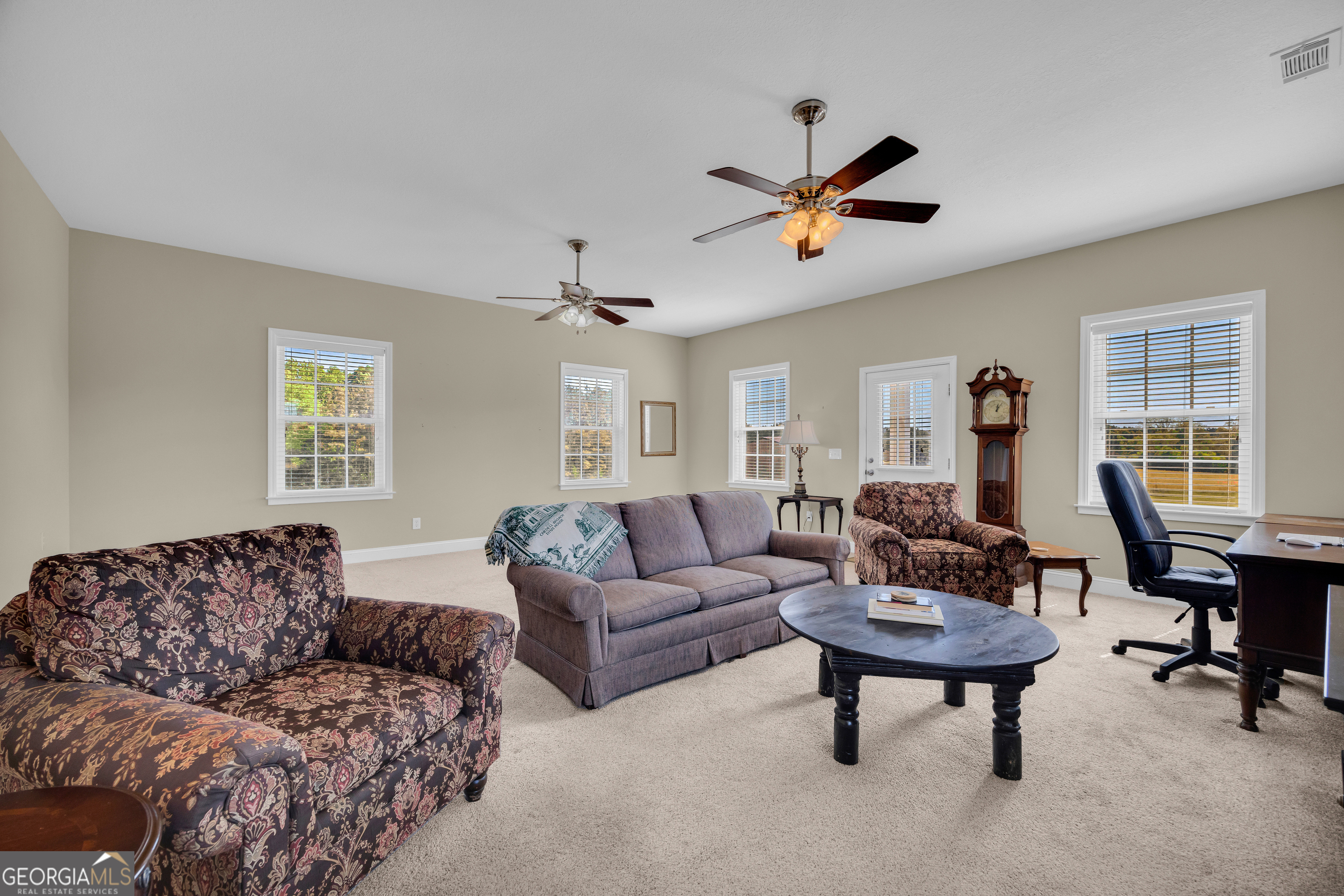 3248 Metasville Road Washington, GA 30673 - Photo 29 of 97 a living room with furniture and a window
