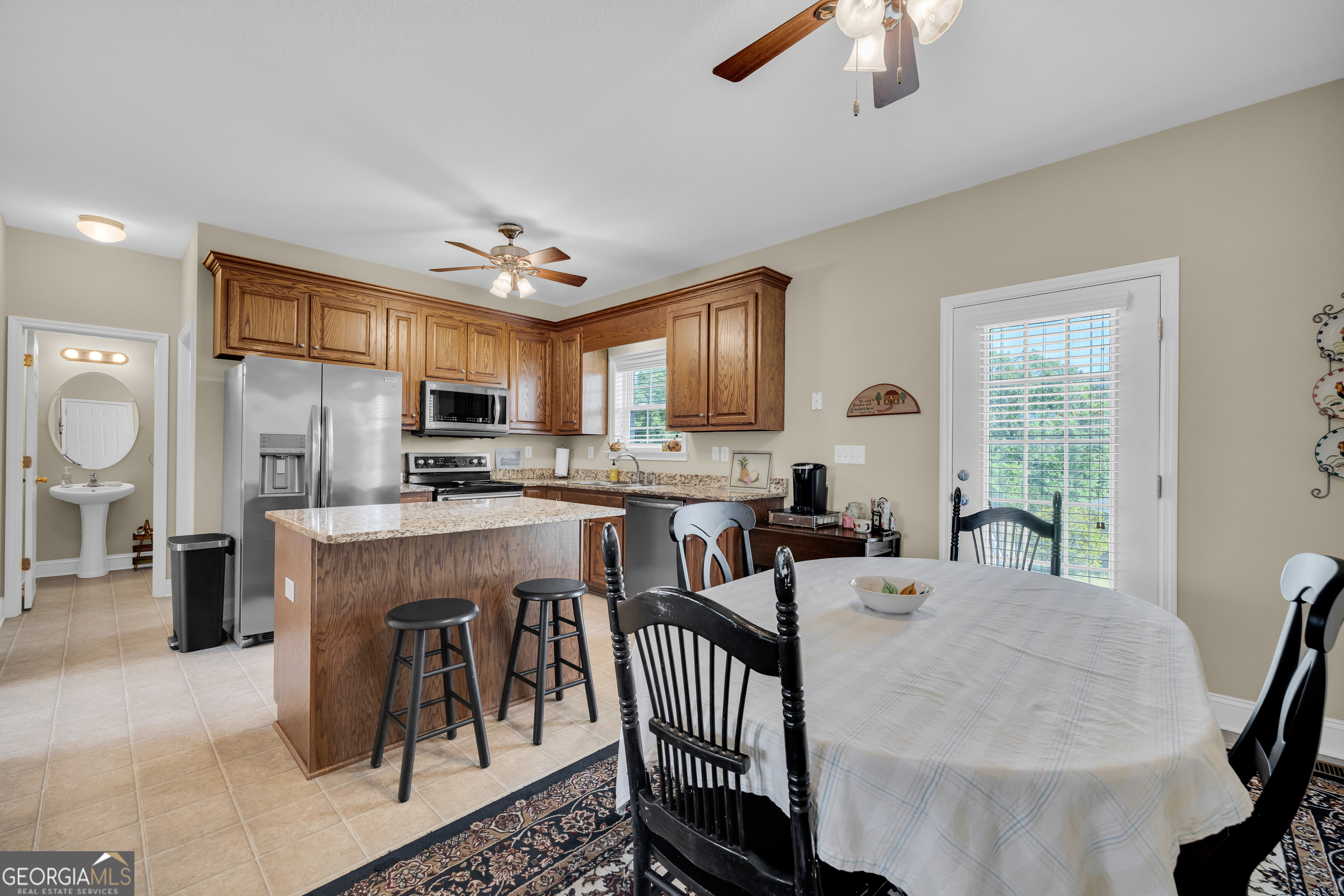 3248 Metasville Road Washington, GA 30673 - Photo 30 of 97 a view of kitchen with sink refrigerator dining table and chairs