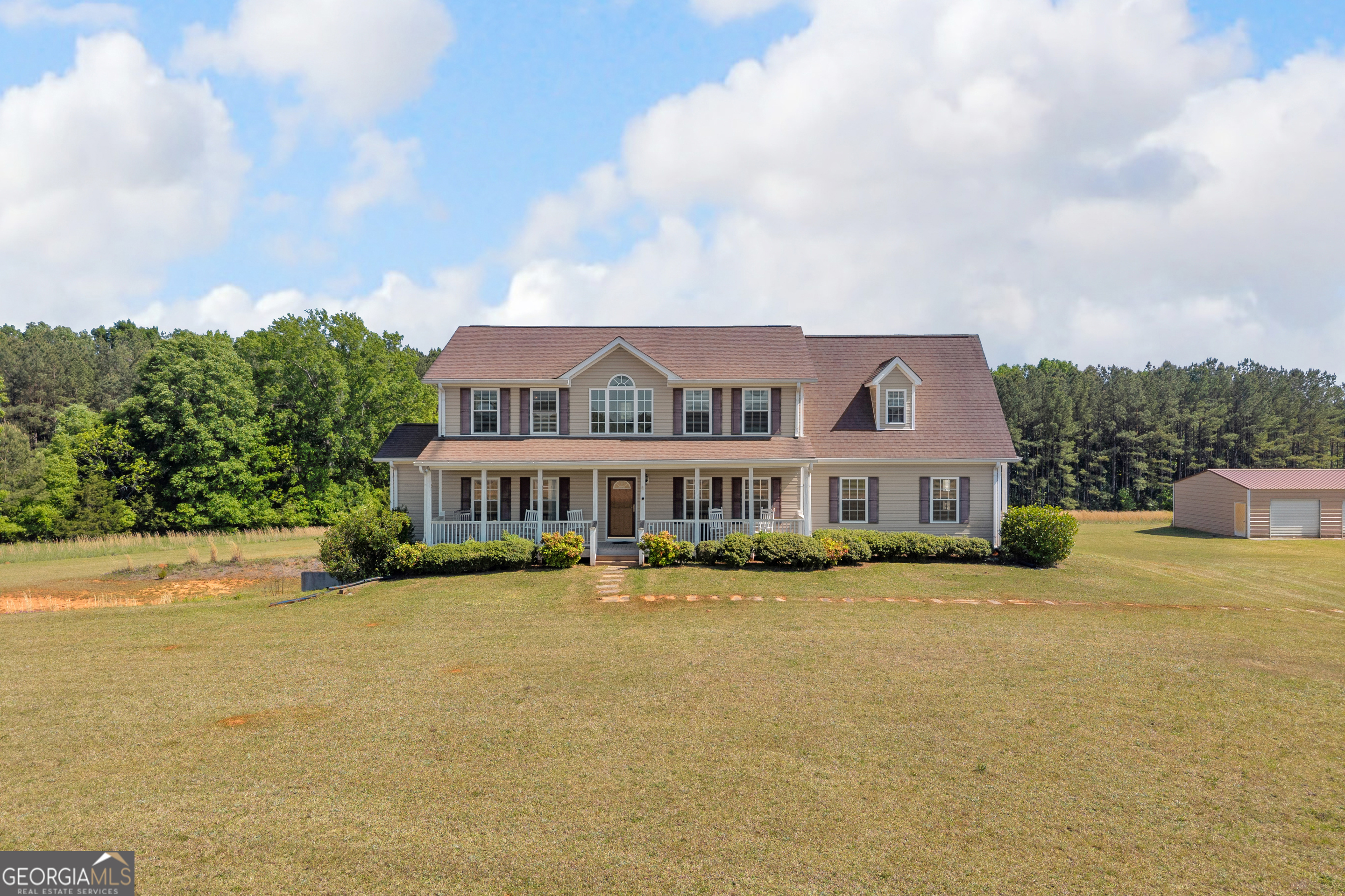 3248 Metasville Road Washington, GA 30673 - Photo 3 of 97 a view of a house with a garden and pathway