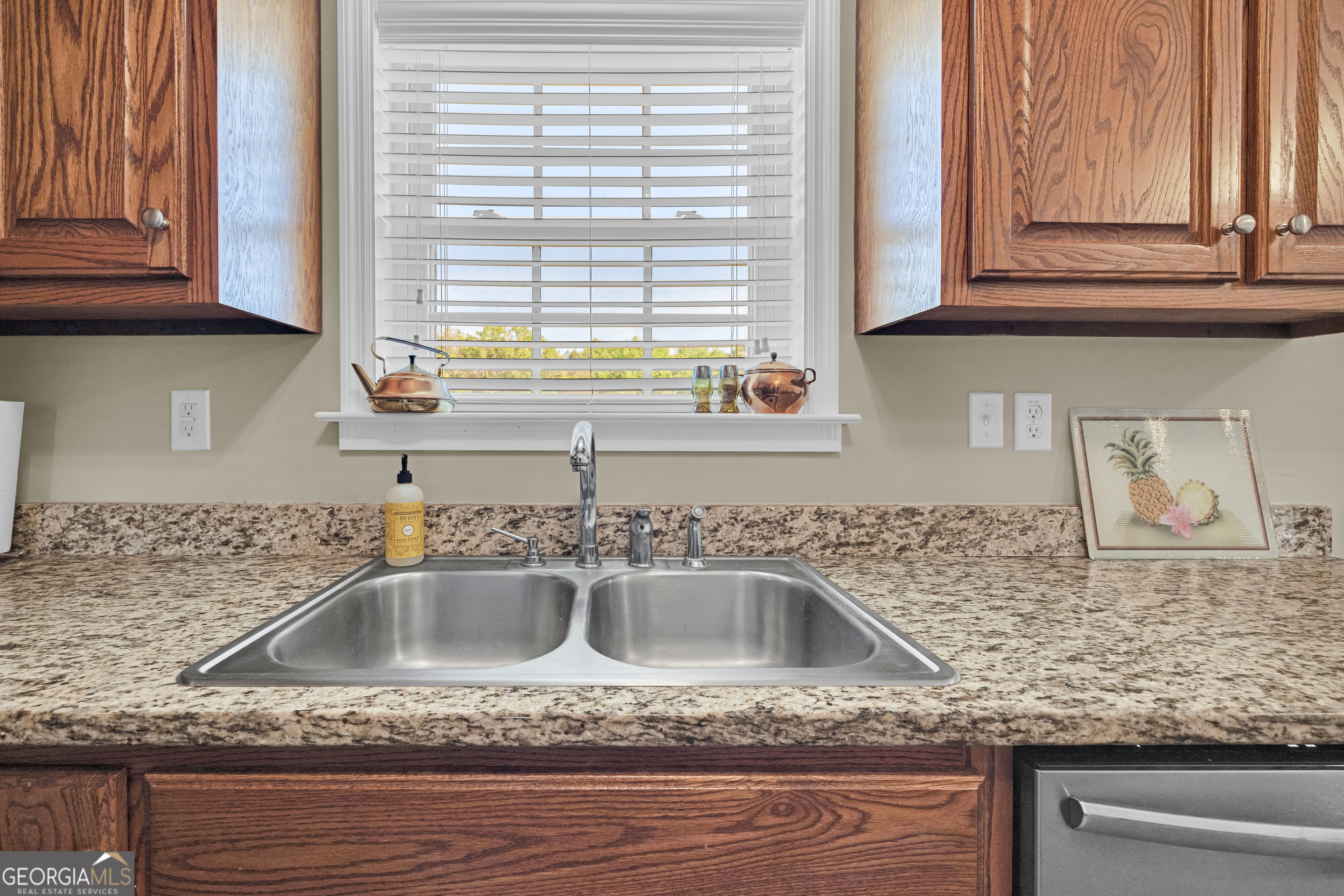 3248 Metasville Road Washington, GA 30673 - Photo 39 of 97 a kitchen with granite countertop a sink and a window