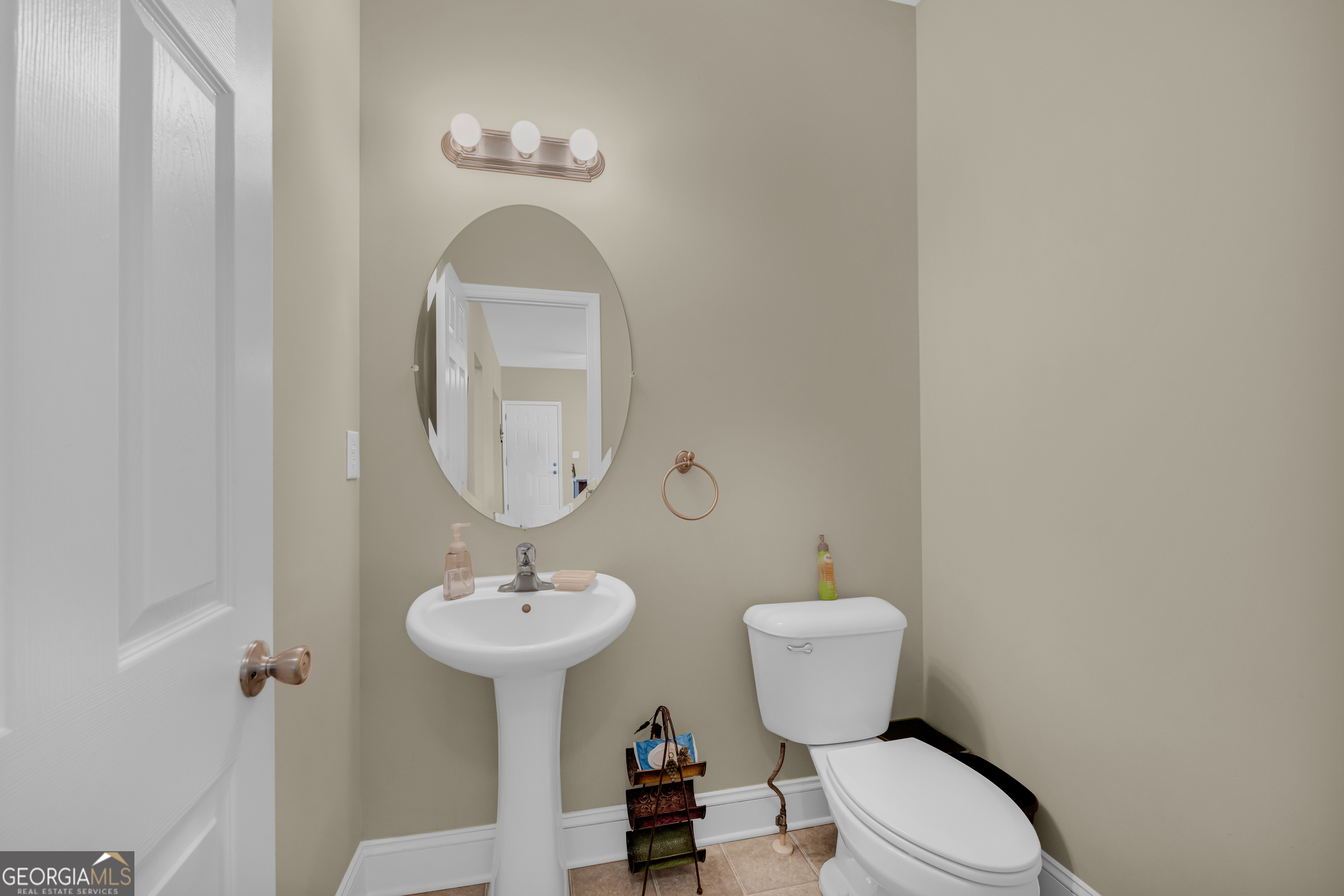 3248 Metasville Road Washington, GA 30673 - Photo 44 of 97 a bathroom with a toilet a sink and a mirror