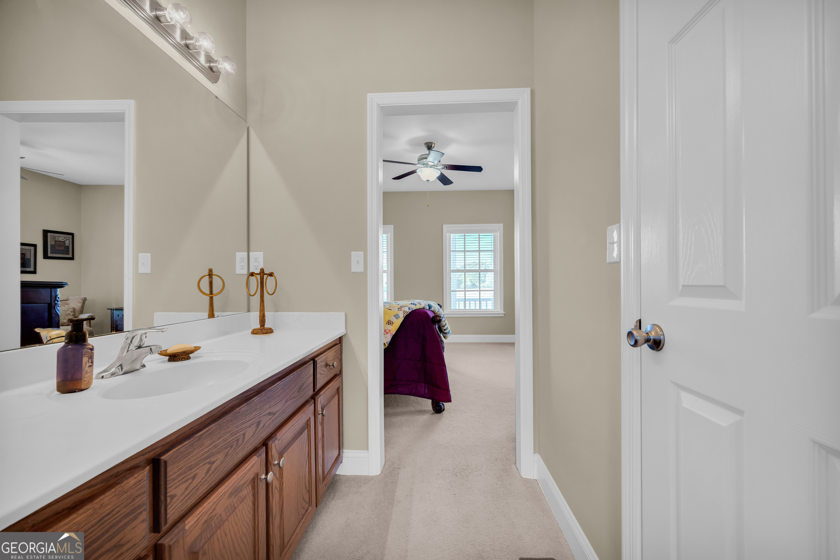 3248 Metasville Road Washington, GA 30673 - Photo 55 of 97 a en suite bathroom with a double vanity sink and mirror