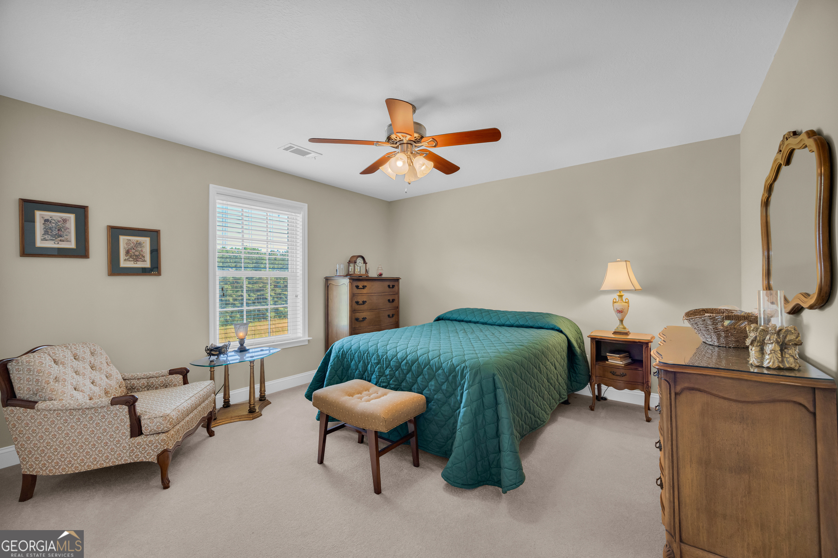 3248 Metasville Road Washington, GA 30673 - Photo 75 of 97 a bedroom with furniture and a chandelier