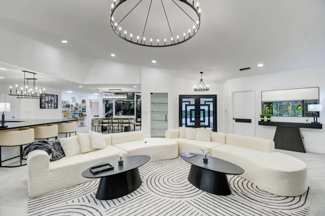 a bedroom with a large bed and a night stand