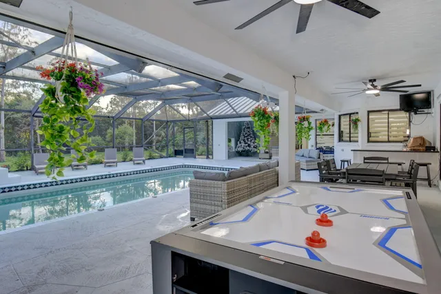 a front view of a house with a garden and plants