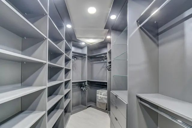 an aerial view of residential house with yard and swimming pool