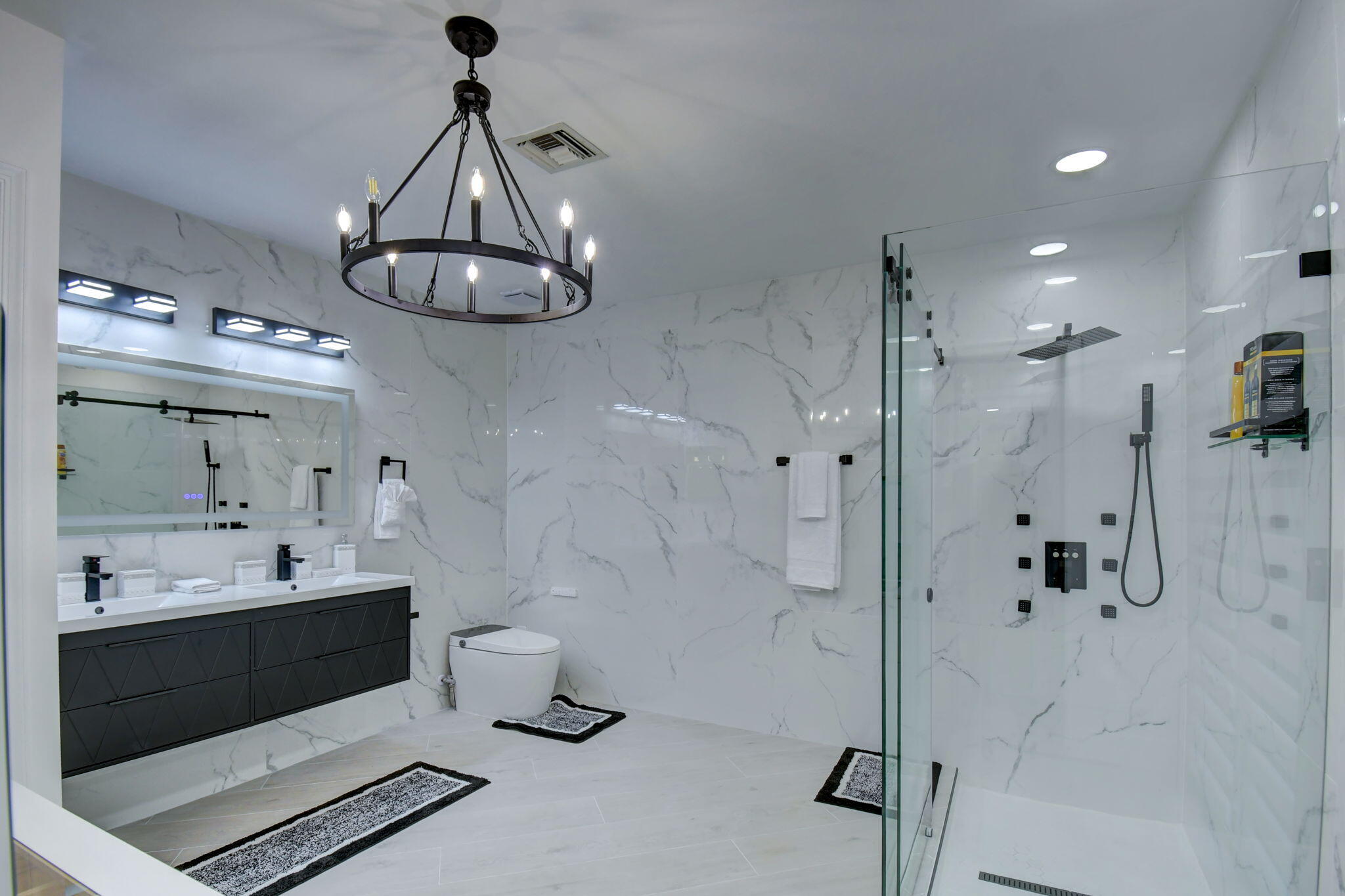 13302 Doubletree Circle Wellington, FL 33414 - Photo 30 of 82 a bathroom with a double vanity sink a toilet and shower