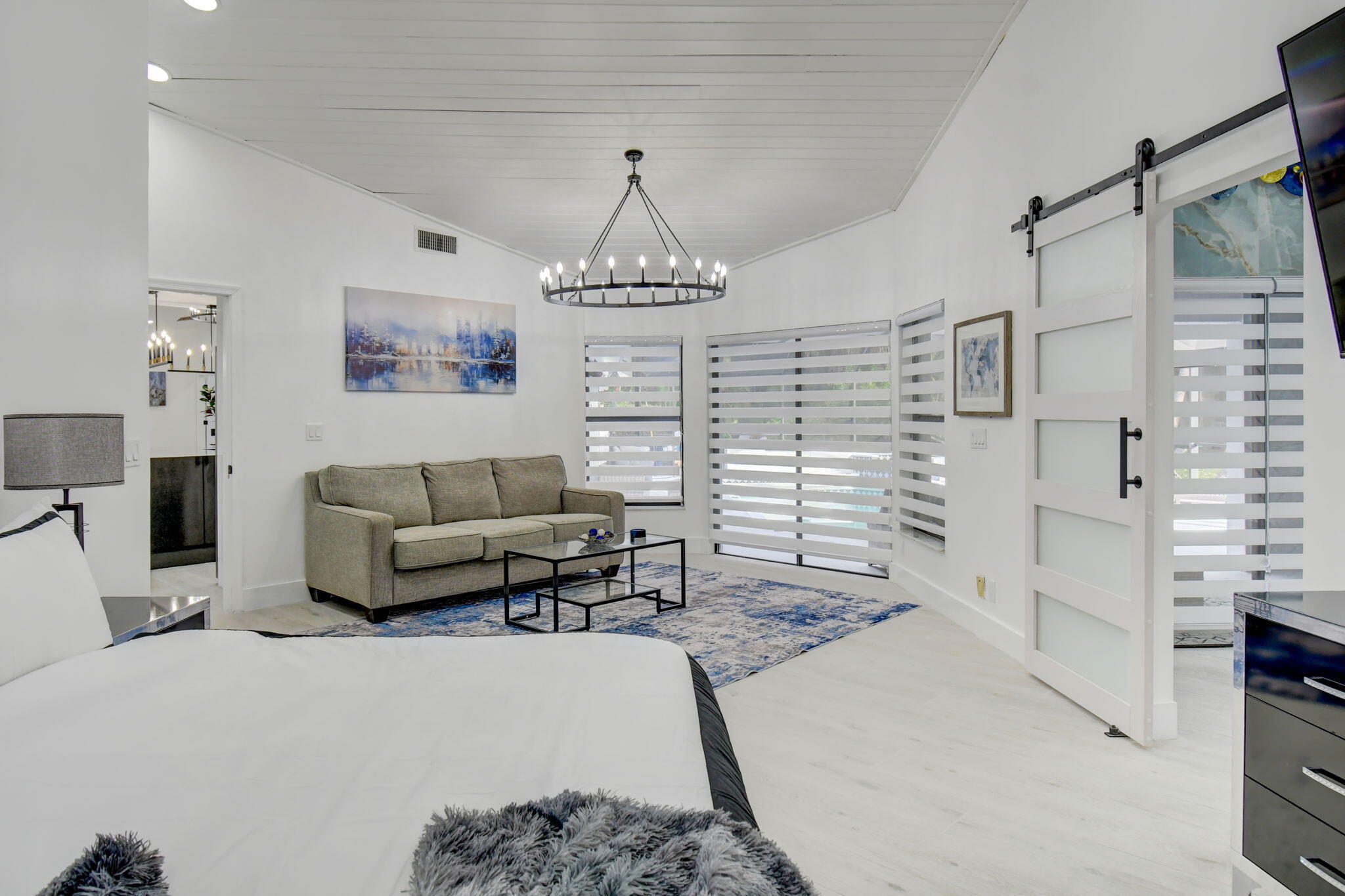 13302 Doubletree Circle Wellington, FL 33414 - Photo 33 of 82 a living room with furniture a chandelier and a painting