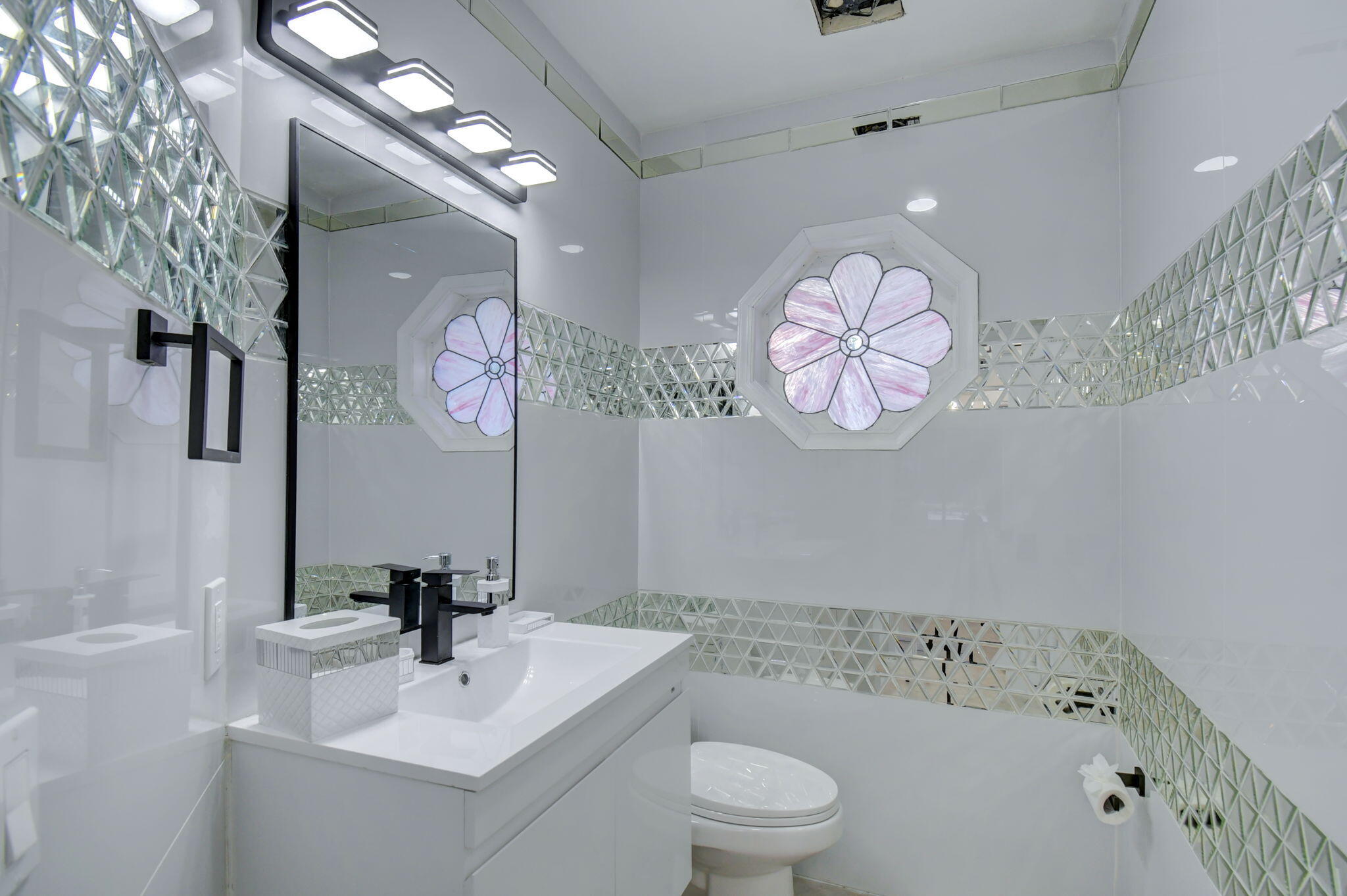 13302 Doubletree Circle Wellington, FL 33414 - Photo 4 of 82 a bathroom with a sink a toilet and a mirror