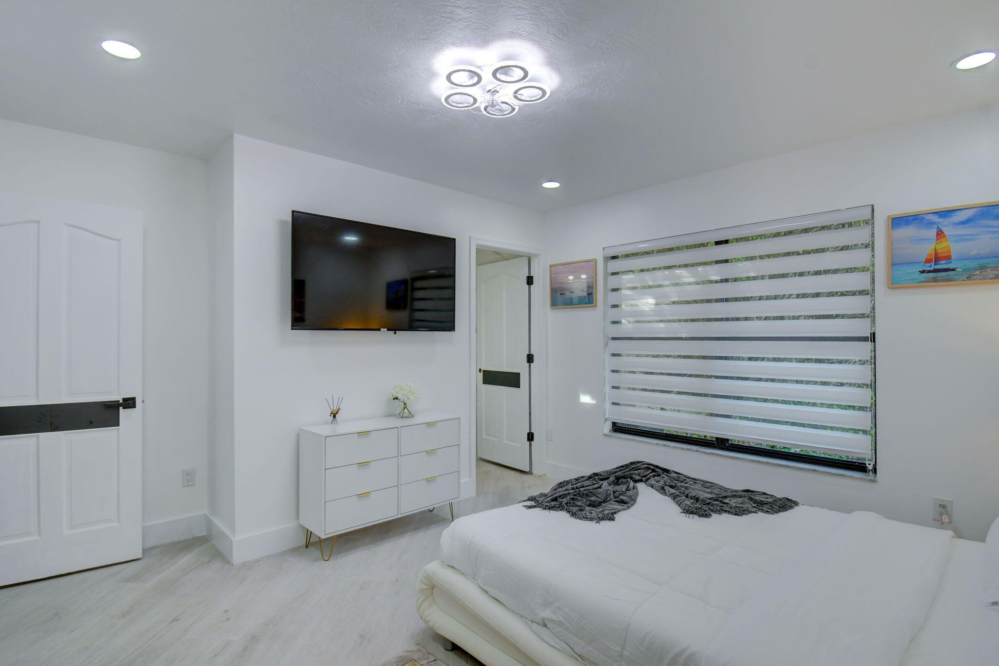 13302 Doubletree Circle Wellington, FL 33414 - Photo 42 of 82 a bedroom with a bed and a flat screen tv