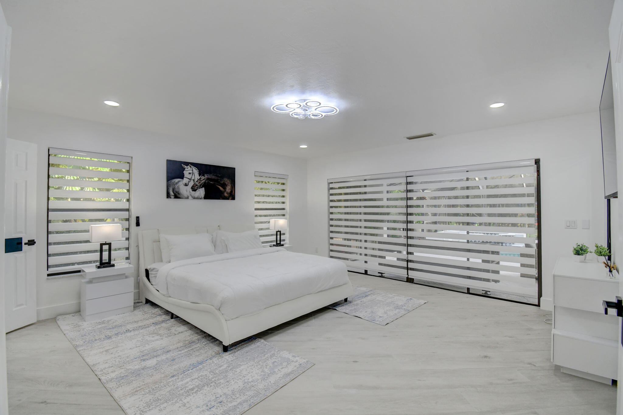 13302 Doubletree Circle Wellington, FL 33414 - Photo 48 of 82 a bedroom with a bed and a night stand