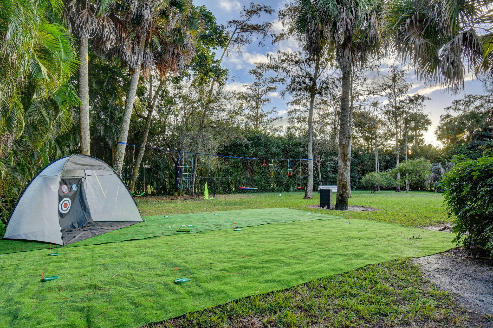 13302 Doubletree Circle Wellington, FL 33414 - Photo 58 of 82 a view of a backyard with swimming pool