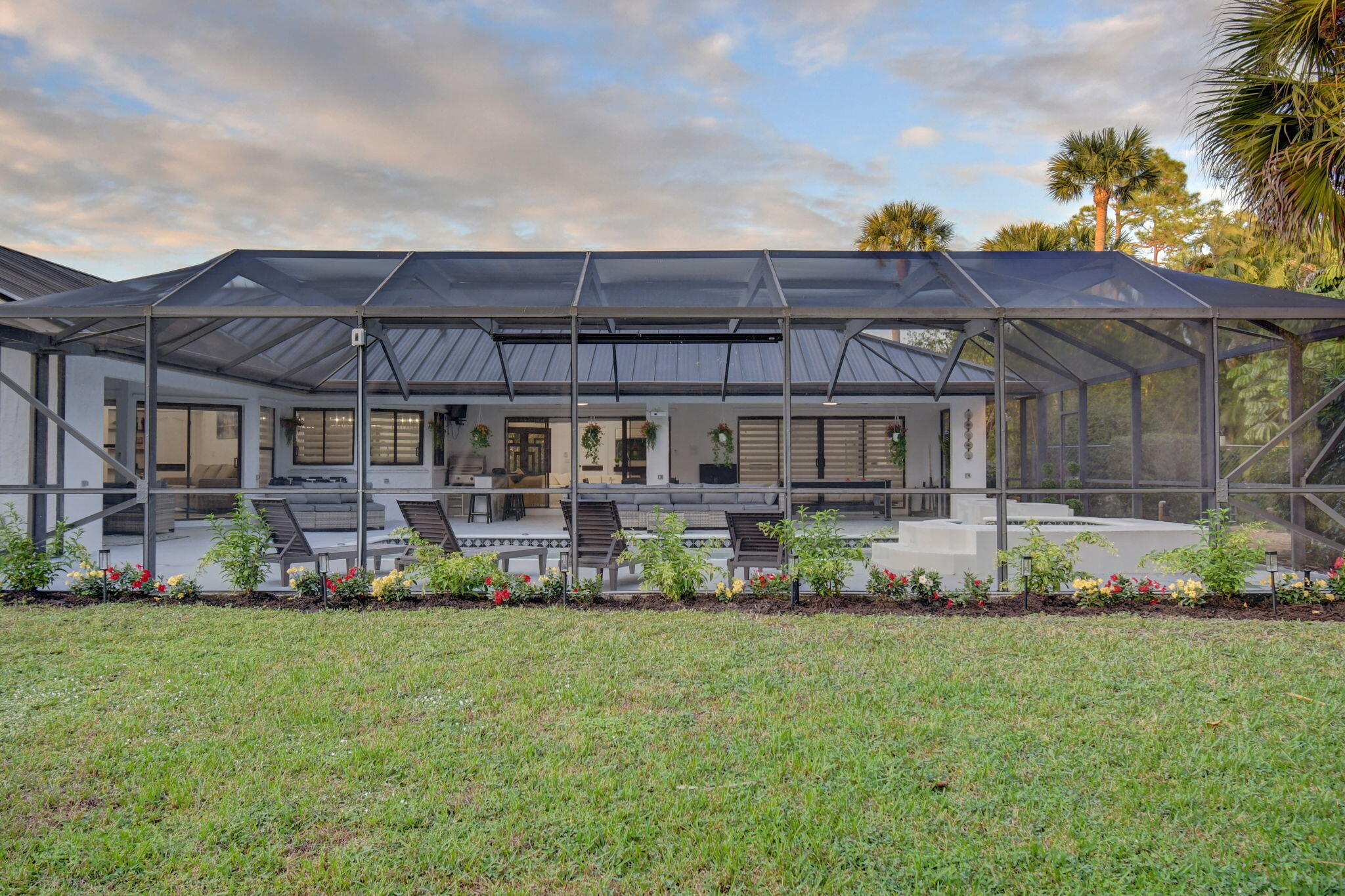 13302 Doubletree Circle Wellington, FL 33414 - Photo 64 of 82 a front view of a house with a garden and plants