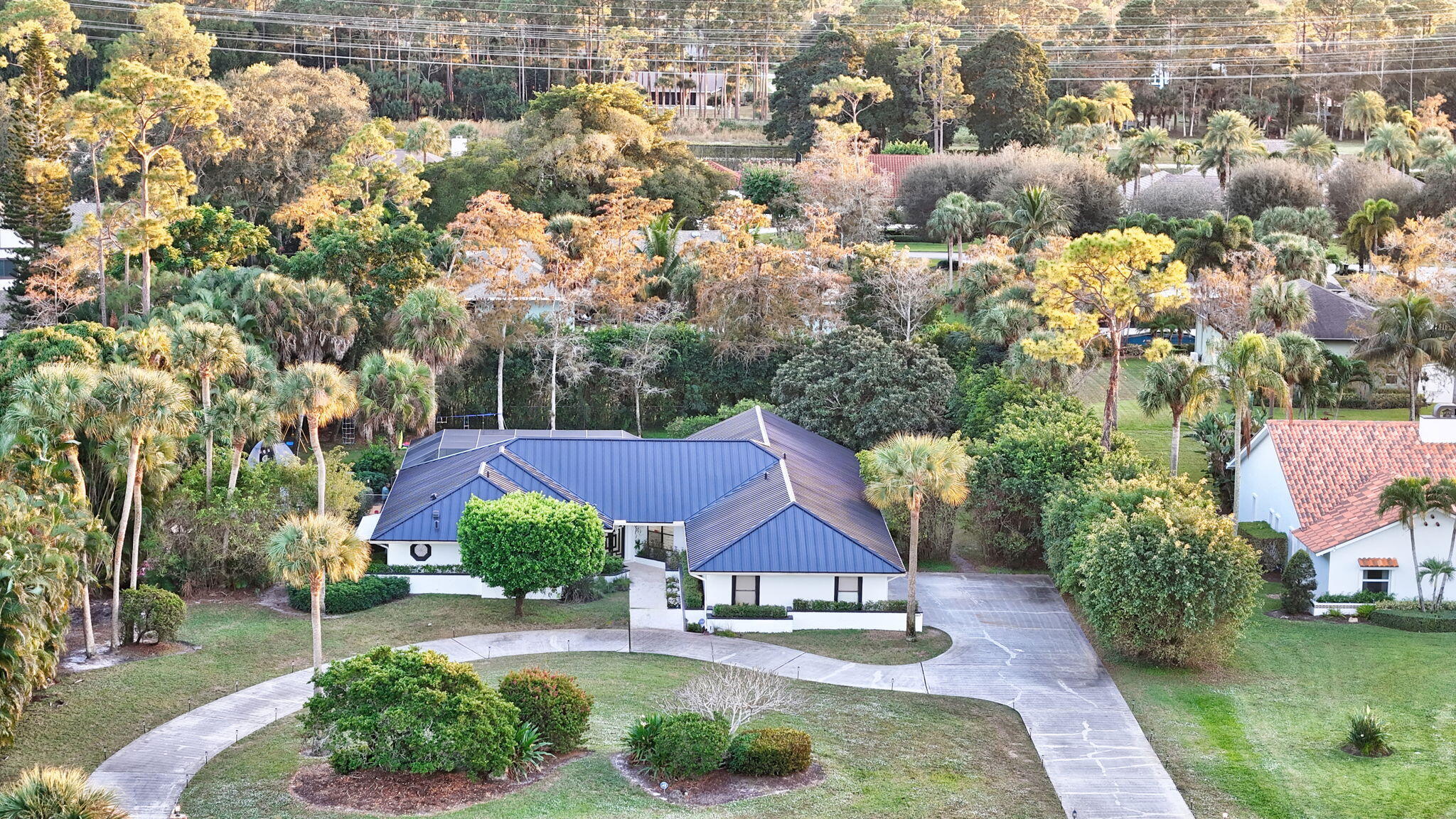 13302 Doubletree Circle Wellington, FL 33414 - Photo 75 of 82 an aerial view of a house with a garden and lake view