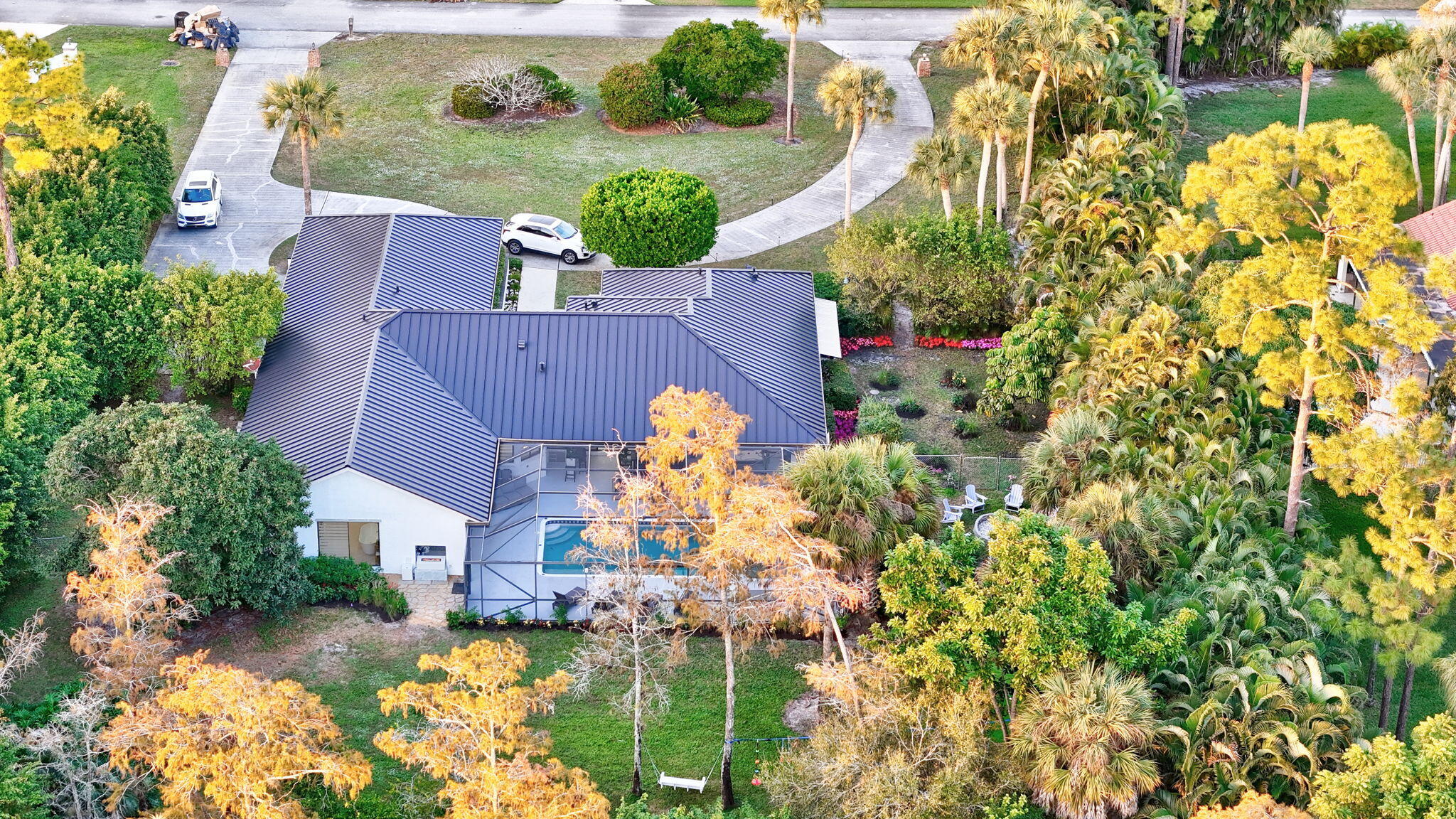 13302 Doubletree Circle Wellington, FL 33414 - Photo 76 of 82 an aerial view of residential house with yard and swimming pool