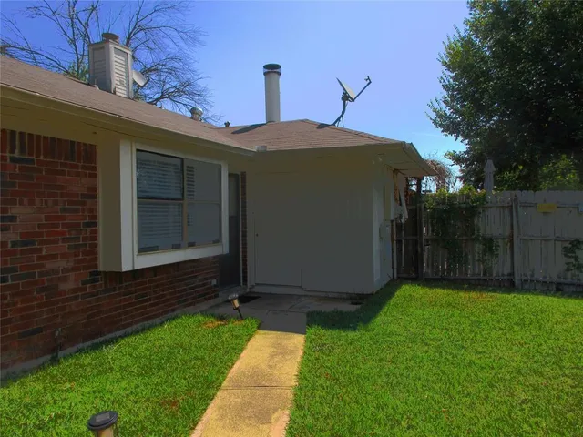 a view of a backyard with a garden