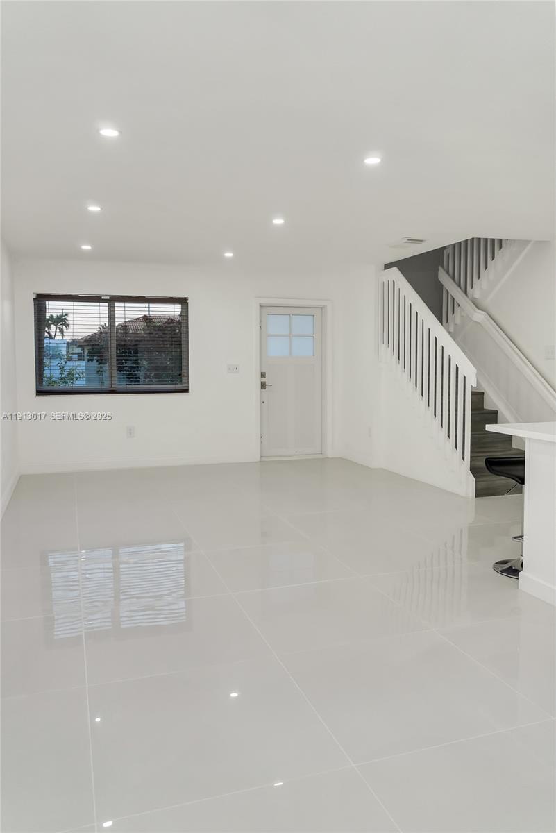 15309 Southwest 183rd Terrace Miami, FL 33187 - Photo 14 of 30 a view of staircase with large window